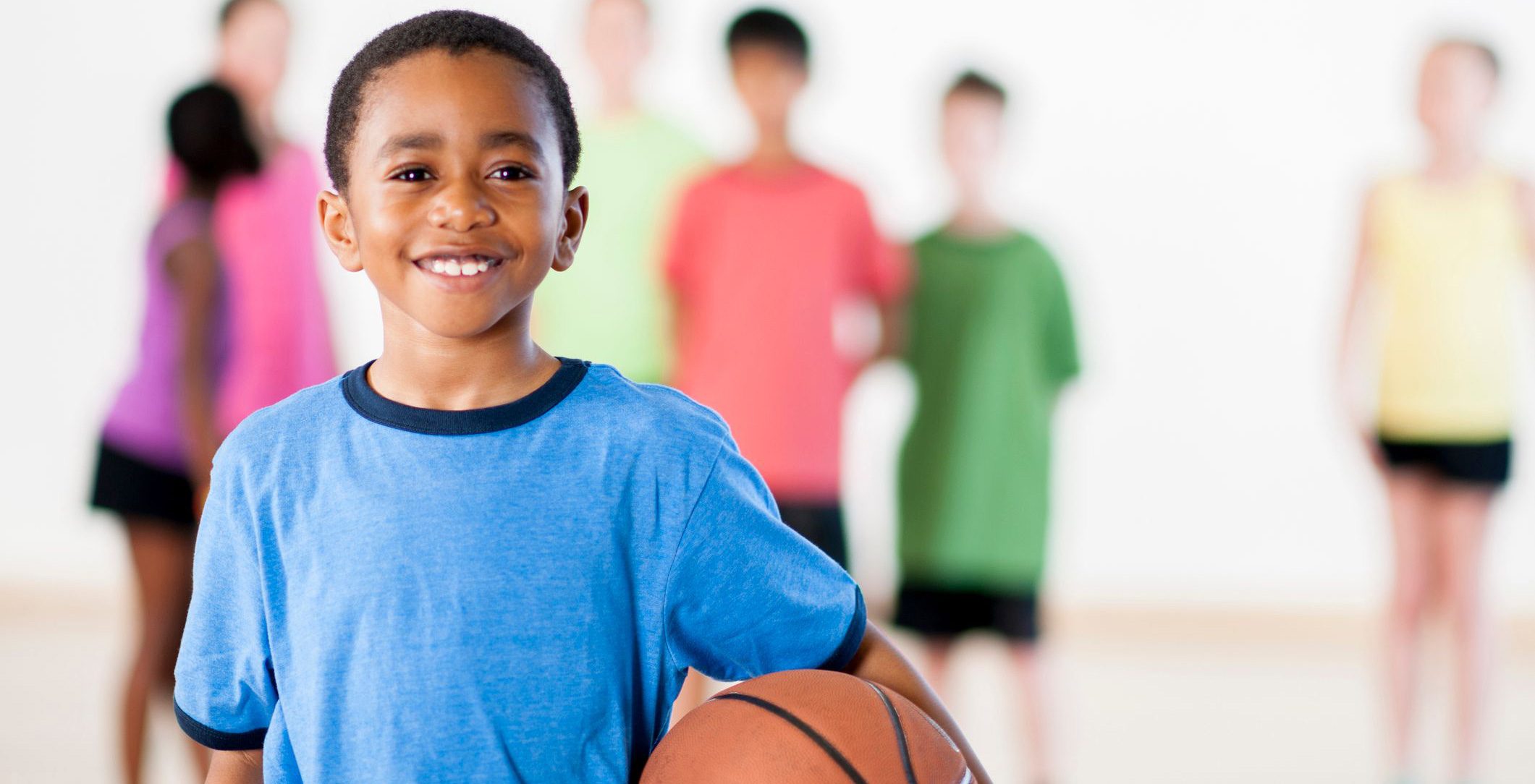 Student holding basketball